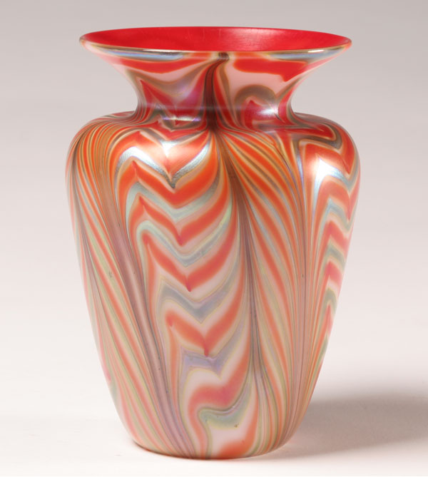 Appraisal: Art glass vase with red and iridescent pulled feather design