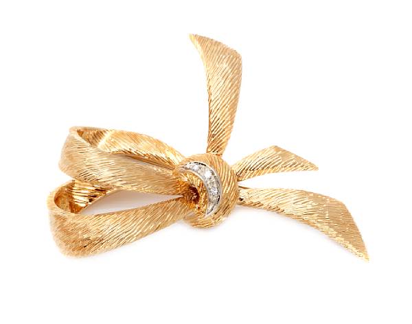 Appraisal: A diamond and k gold bow brooch signed Cartier g