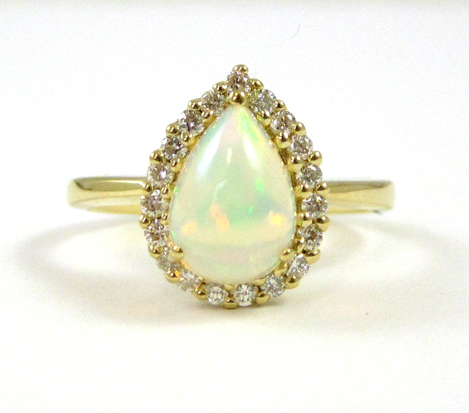 Appraisal: OPAL DIAMOND AND FOURTEEN KARAT GOLD RING with round-cut diamond