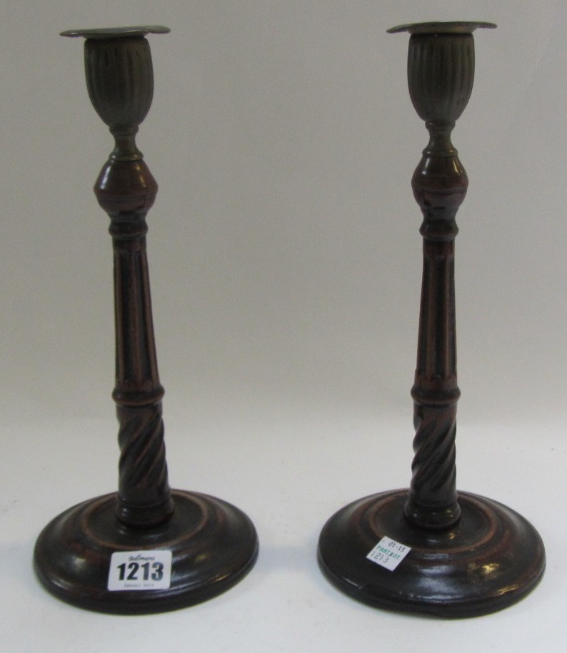 Appraisal: A pair of George III mahogany candlesticks with fluted and