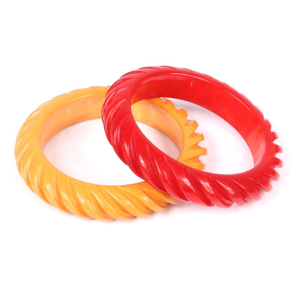 Appraisal: TWO VINTAGE BAKELITE DEEPLY CARVED MATCHING BANGLE BRACELETS IN RED