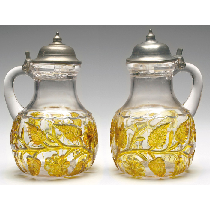 Appraisal: Hobbs syrup pitchers pair amber leaf and flowers pewter lid