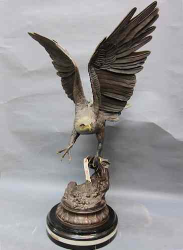 Appraisal: ORNITHOLOGICAL BRONZE SCULPTURE a large eagle taking flight after the