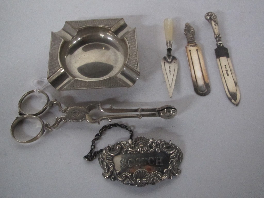 Appraisal: Lot comprising silver ashtray decanter label three bookmarks and a