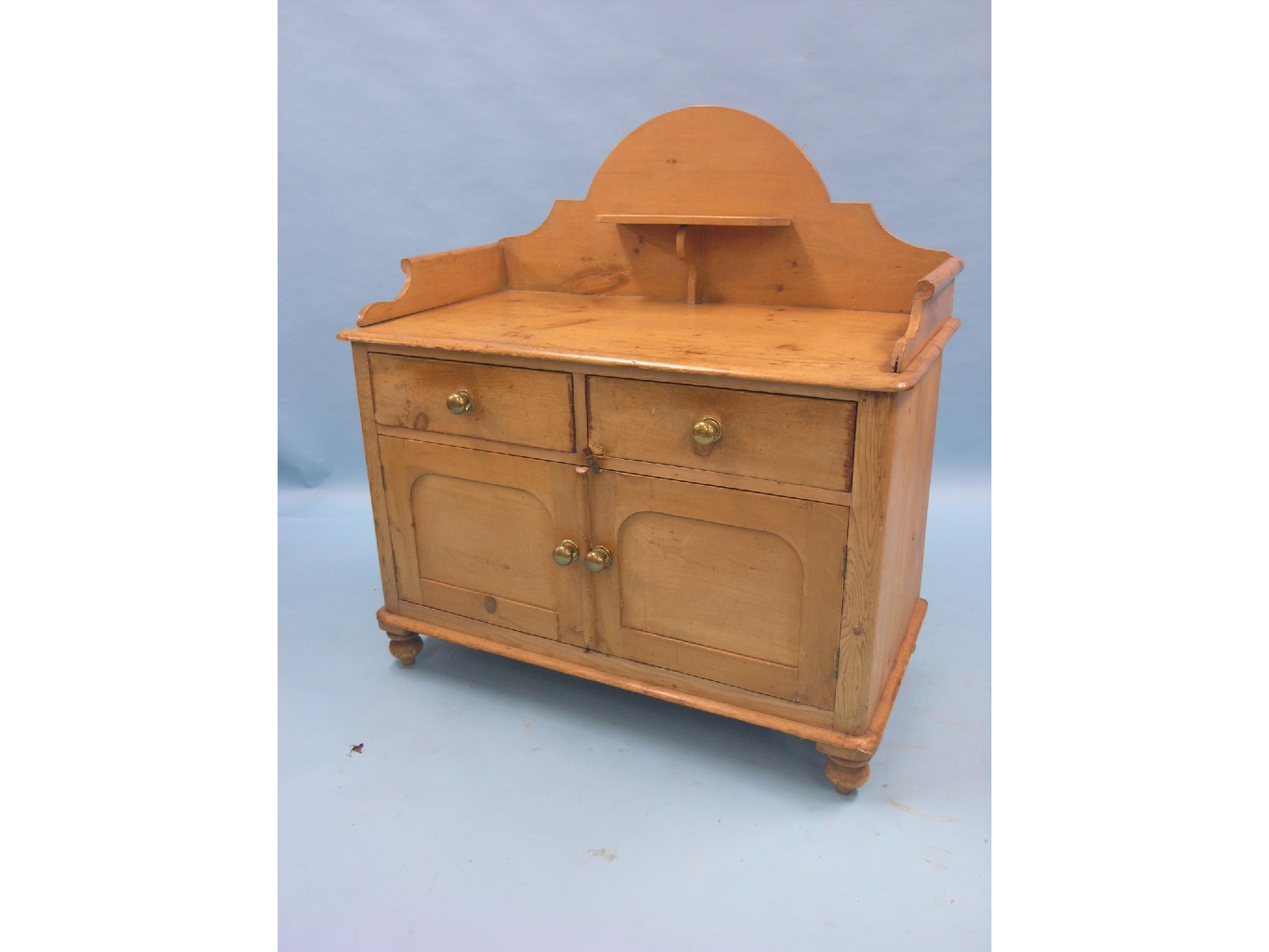 Appraisal: A Victorian stripped pine wash stand raised back with overshelf