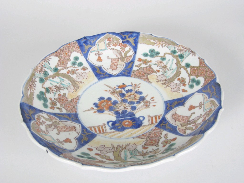 Appraisal: An Imari Shallow Dish painted figures shrubs and vase of