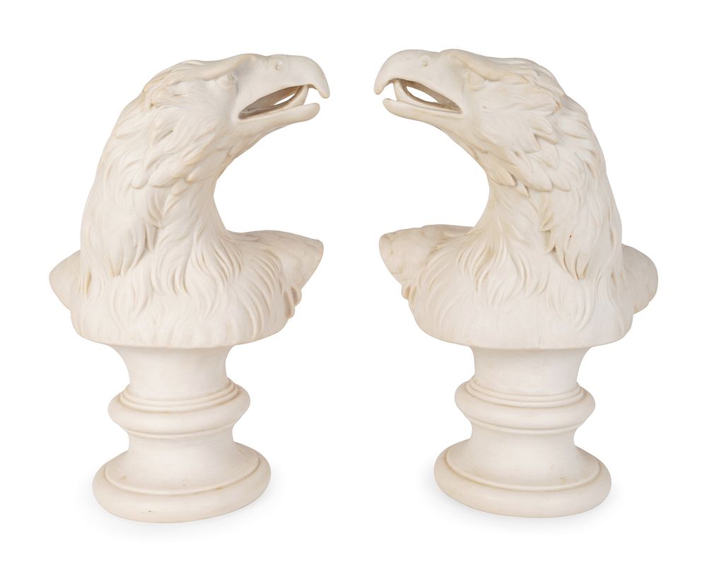 Appraisal: A Pair of Molded Composition Eagle Heads Height x width