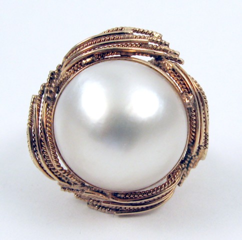 Appraisal: MABE PEARL AND TEN KARAT GOLD RING centering a mm