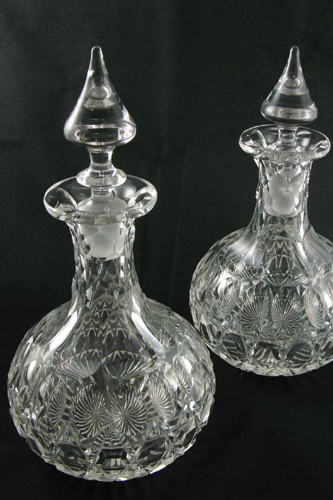 Appraisal: TWO MATCHING PATTERN CUT CRYSTAL CORDIAL DECANTERS in thumbprint and