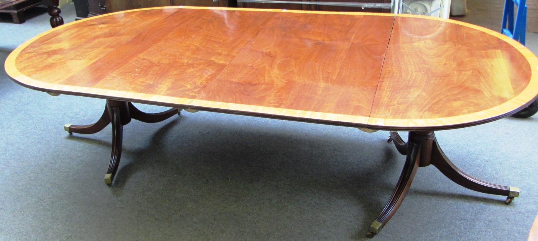 Appraisal: A George III style mahogany 'D' end extending dining table