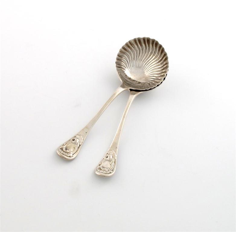 Appraisal: A pair of George III silver sauce ladles