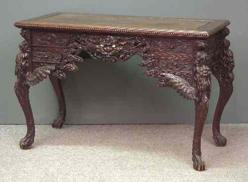 Appraisal: A late th early th Century Chinese stained-wood desk boldly