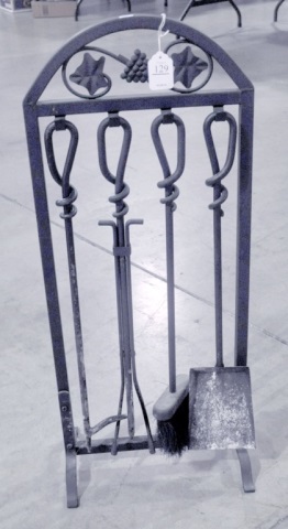 Appraisal: Decorative Wrought Iron Fire Set on StandPoker fire tongs shovel