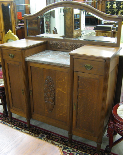 Appraisal: SMALL OAK SIDEBOARD Belgian early th century having an arched