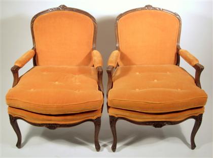 Appraisal: Pair of Louis XV style carved fruitwood fauteuilCarved shaped crest