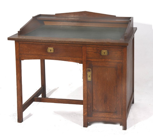 Appraisal: AN AUSTRIAN SECESSIONIST OAK DESK with inset green leather writing