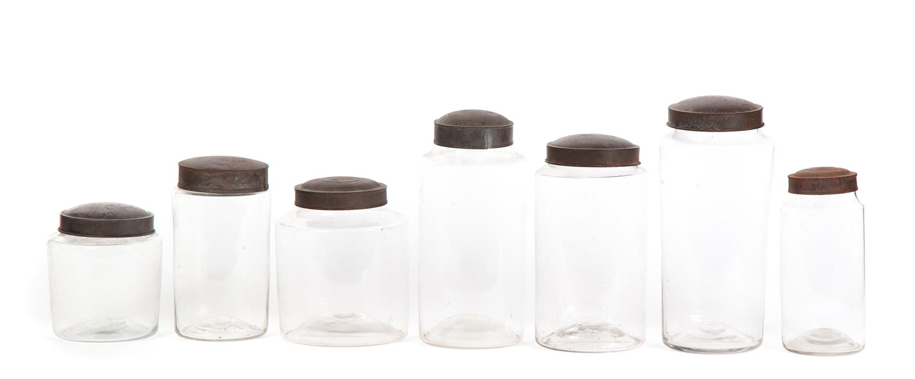 Appraisal: SEVEN BLOWN GLASS CANISTER JARS WITH TIN LIDS American rd