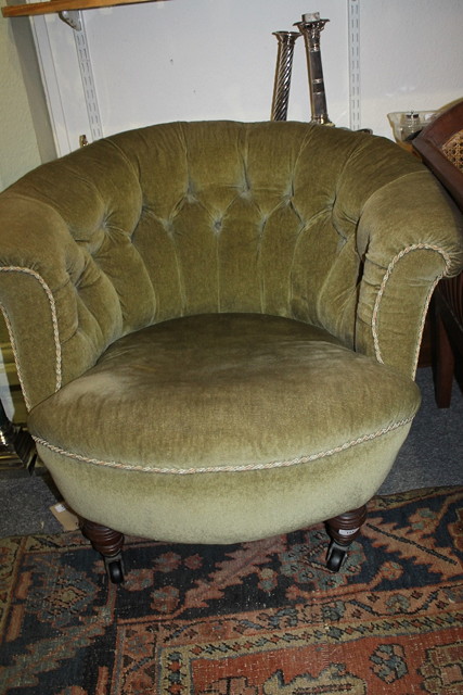 Appraisal: A VICTORIAN UPHOLSTERED TUB CHAIR with button back finish green