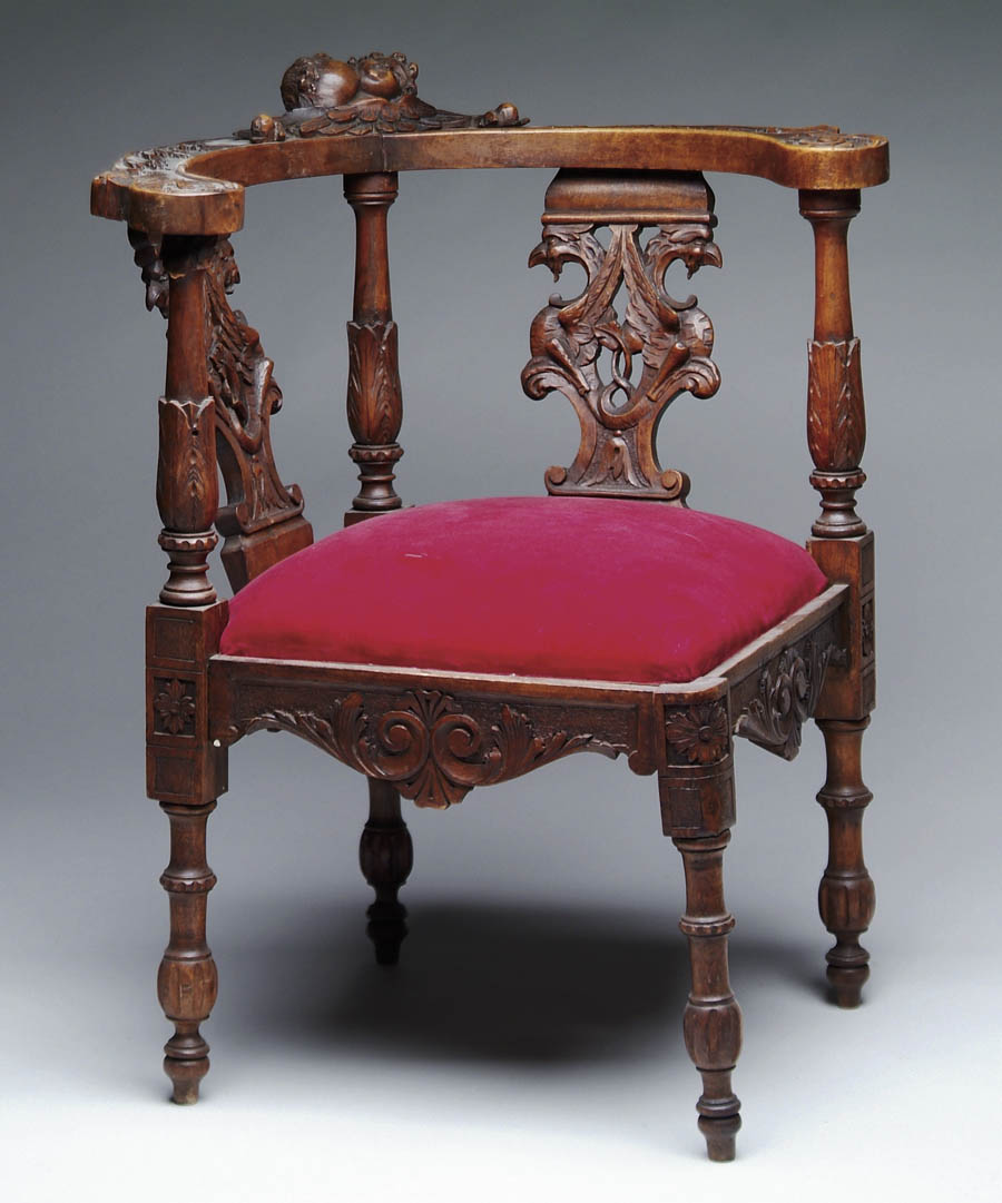 Appraisal: OUTSTANDING VICTORIAN CARVED CORNER CHAIR The removable slip seat reupholstered