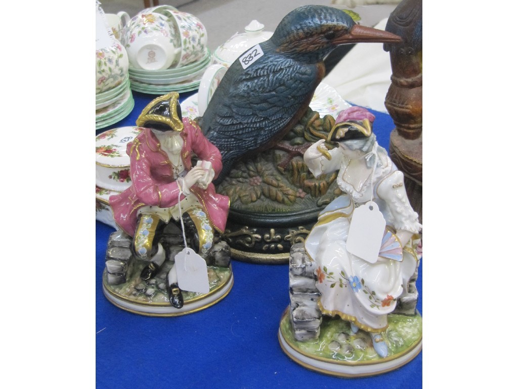 Appraisal: Pair of continental figures and a Kingfisher doorstop