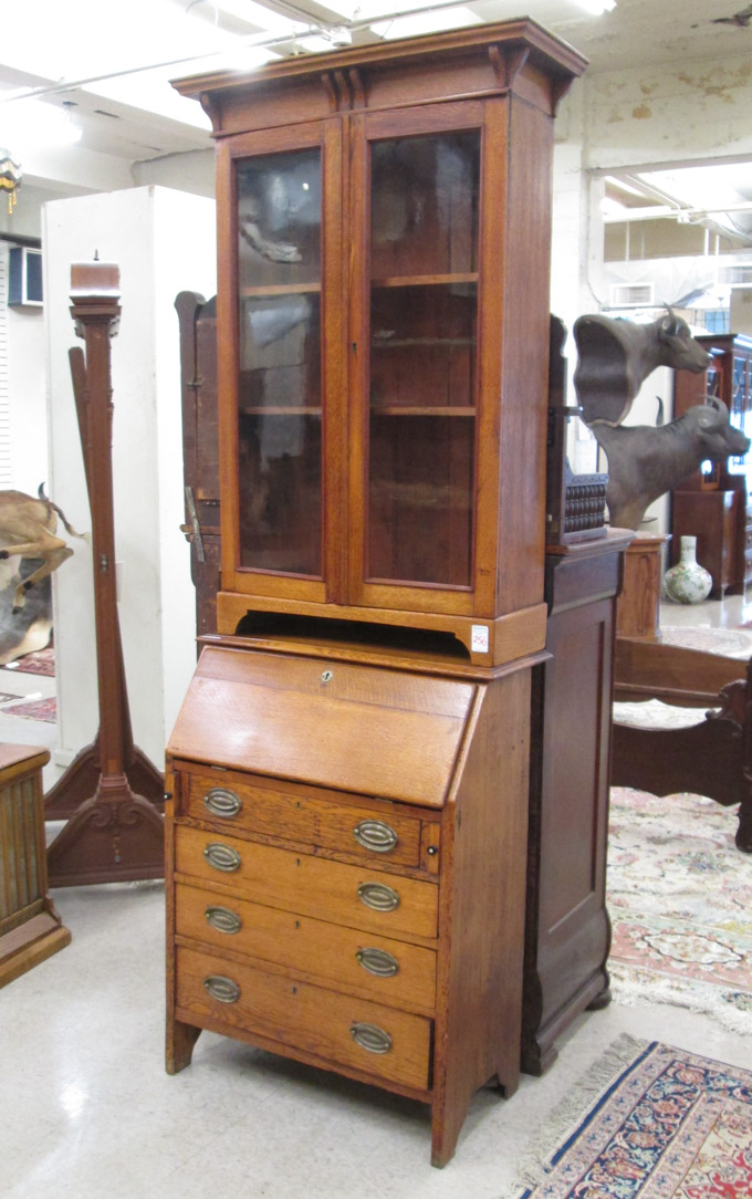 Appraisal: AN OAK SECRETARY BOOKCASE English late th century featuring a