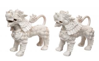 Appraisal: A PAIR OF BLANC-DE-CHINE DOGSeach dog with ornamental fur laid