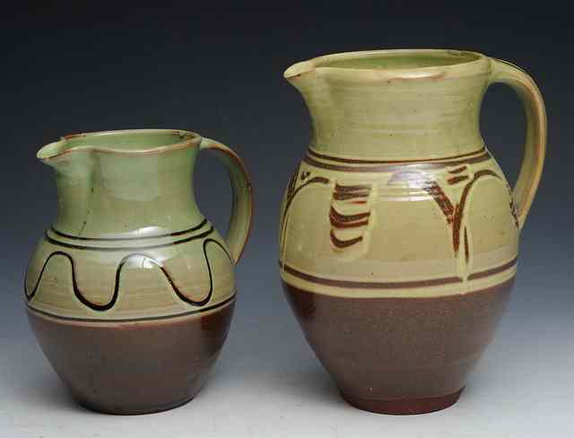 Appraisal: Winchcombe PotteryA slipware jug dark slip meander on light green