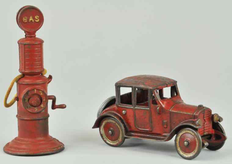 Appraisal: KENTON SEDAN AND GAS PUMP Cast iron painted in red