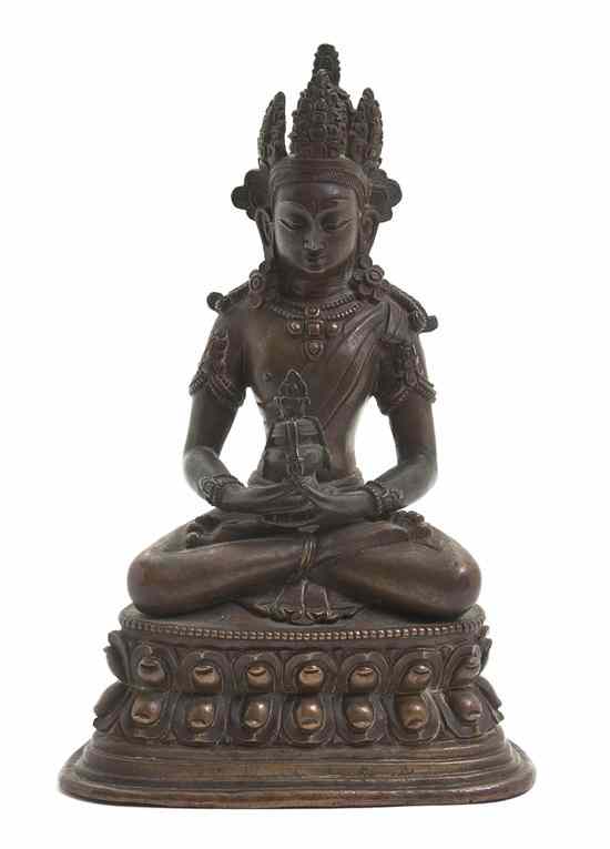 Appraisal: A Southeast Asian Bronze Figure of a Deity depicted seated