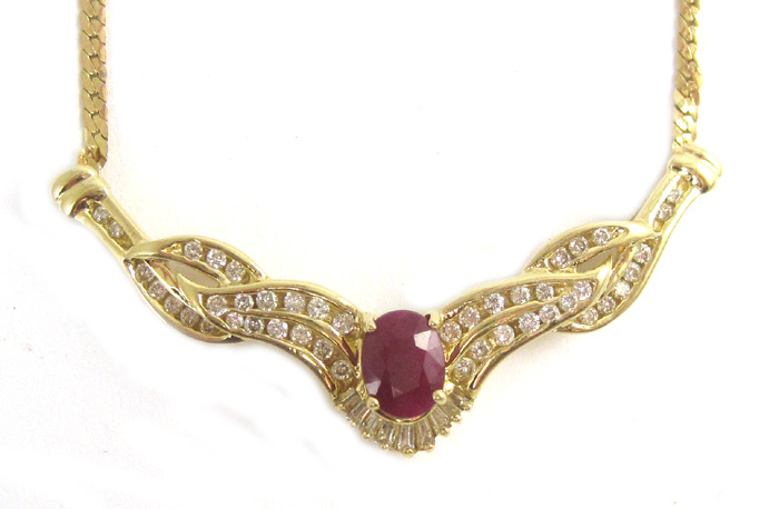 Appraisal: RUBY DIAMOND AND FOURTEEN KARAT GOLD NECKLACE set between two