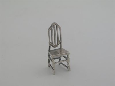 Appraisal: A modern miniature model of a rustic chair incuse makers