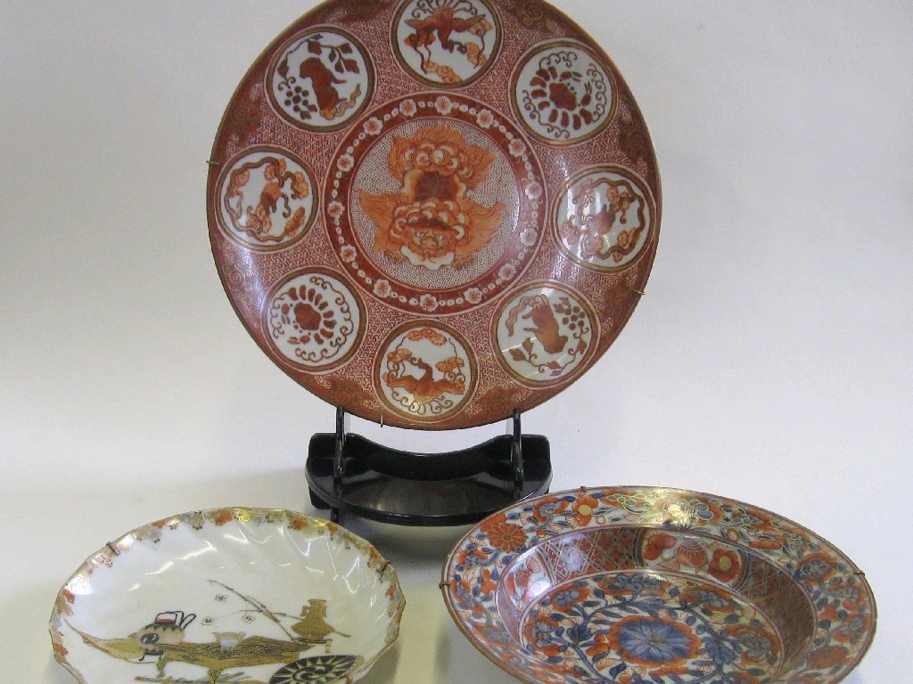 Appraisal: Three oriental dishes one decorated with an iron red dragon