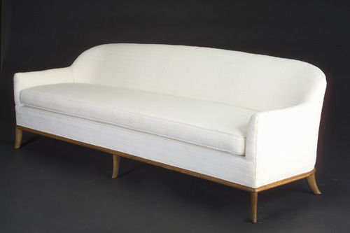 Appraisal: T H ROBSJOHN-GIBBINGS Long sofa with a rounded back and