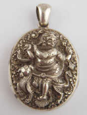 Appraisal: A white metal tests silver locket depicting an Eastern deity