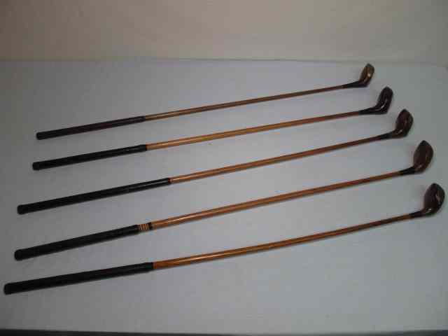 Appraisal: Fancy face wood shaft golf clubs clubs Includes a driver