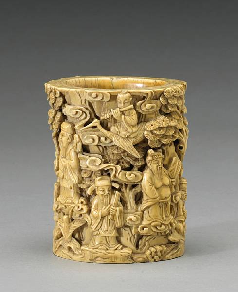 Appraisal: A carved ivory brush pot Qing Dynasty In the form