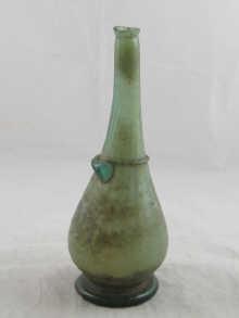 Appraisal: An th century Persian bottle with applied decoration approx cm