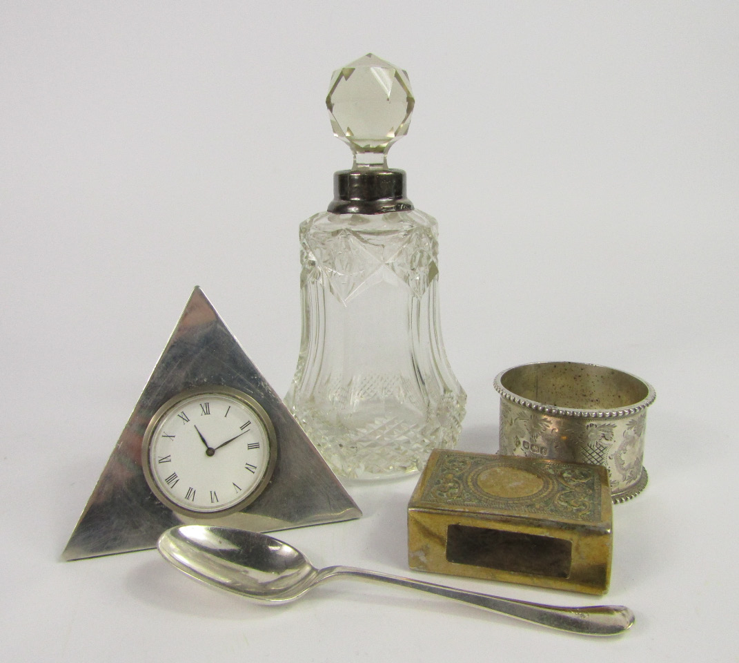 Appraisal: A Grand Met pyramid form silver travel clock London napkin