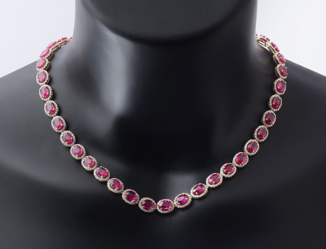 Appraisal: RUBY RIVIERE NECKLACE K yellow gold necklace of prong set