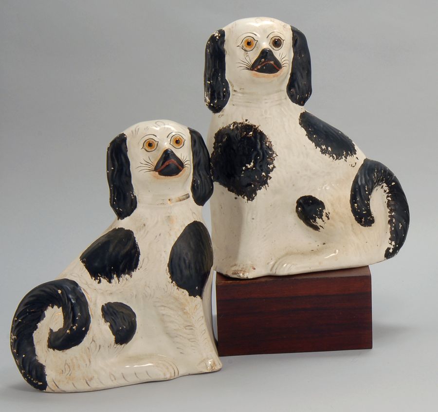 Appraisal: PAIR OF ENGLISH BLACK AND WHITE STAFFORDSHIRE DOGS Second PeriodWith