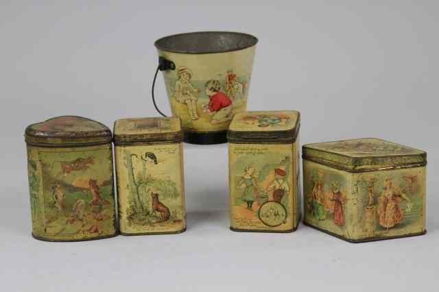 Appraisal: FIVE JUVENILE BISCUIT TINS s- Lot includes a Jacob's sand