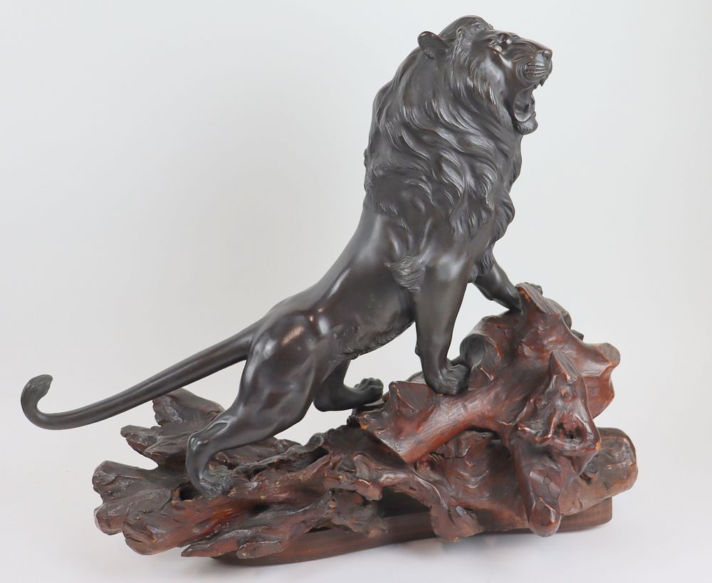 Appraisal: Japanese Bronze Of A Lion On Wood Stand Nice quality