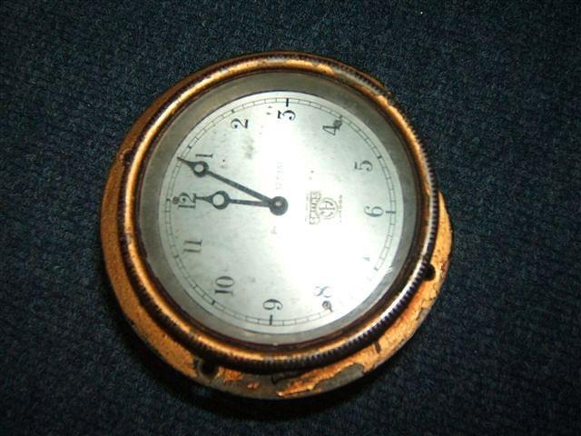 Appraisal: AN EARLY TH CENTURY SMITHS AUTOMOBILE CLOCK with silvered dial