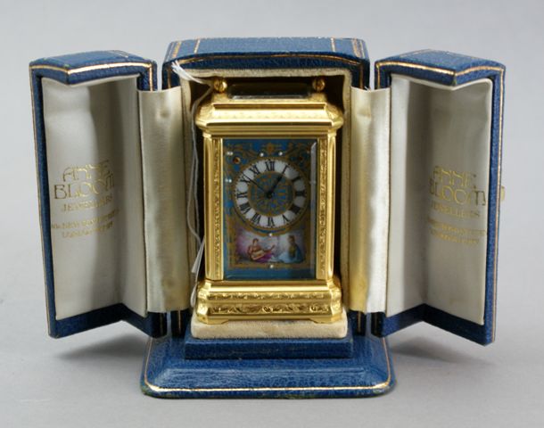 Appraisal: A French bedside clock in th century taste the painted