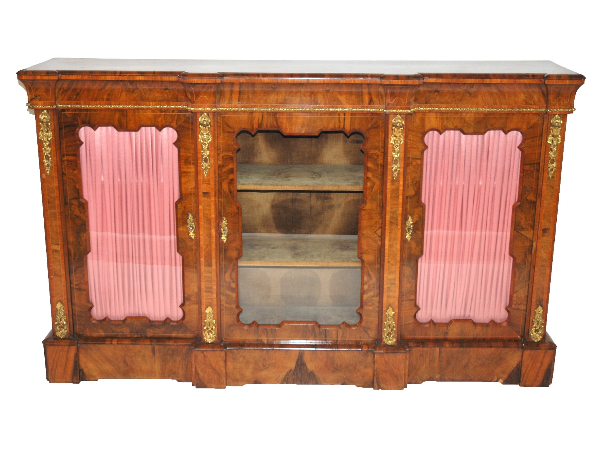 Appraisal: A Victorian rosewood breakfront credenzawith three glazed doors enclosing shelves