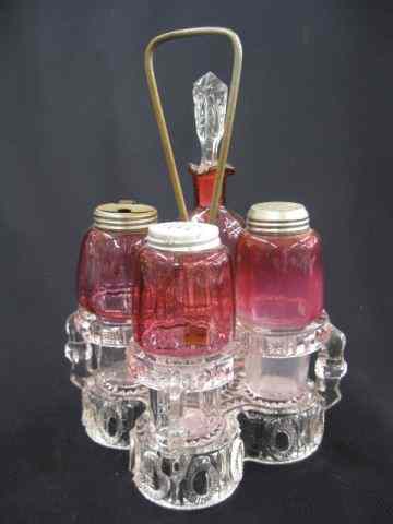 Appraisal: Victorian Art Glass Castor Set Cranberrybottles in clear pattern glass