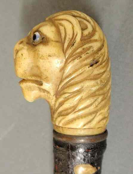 Appraisal: Late th c sword cane with carved ivory lion head