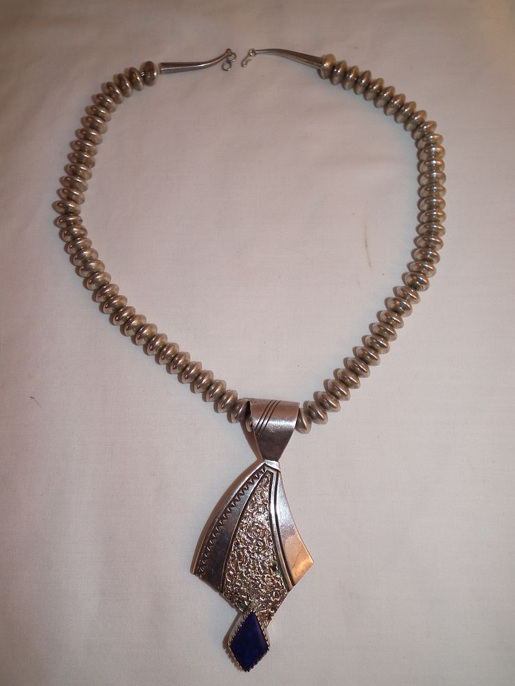 Appraisal: BEGAY STERLING NAVAJO NECKLACE Large sterling silver Navajo pawn necklace