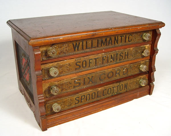 Appraisal: WILLIMANTIC FOUR DRAWER SPOOL CABINET Compartmented interior original glass knobs