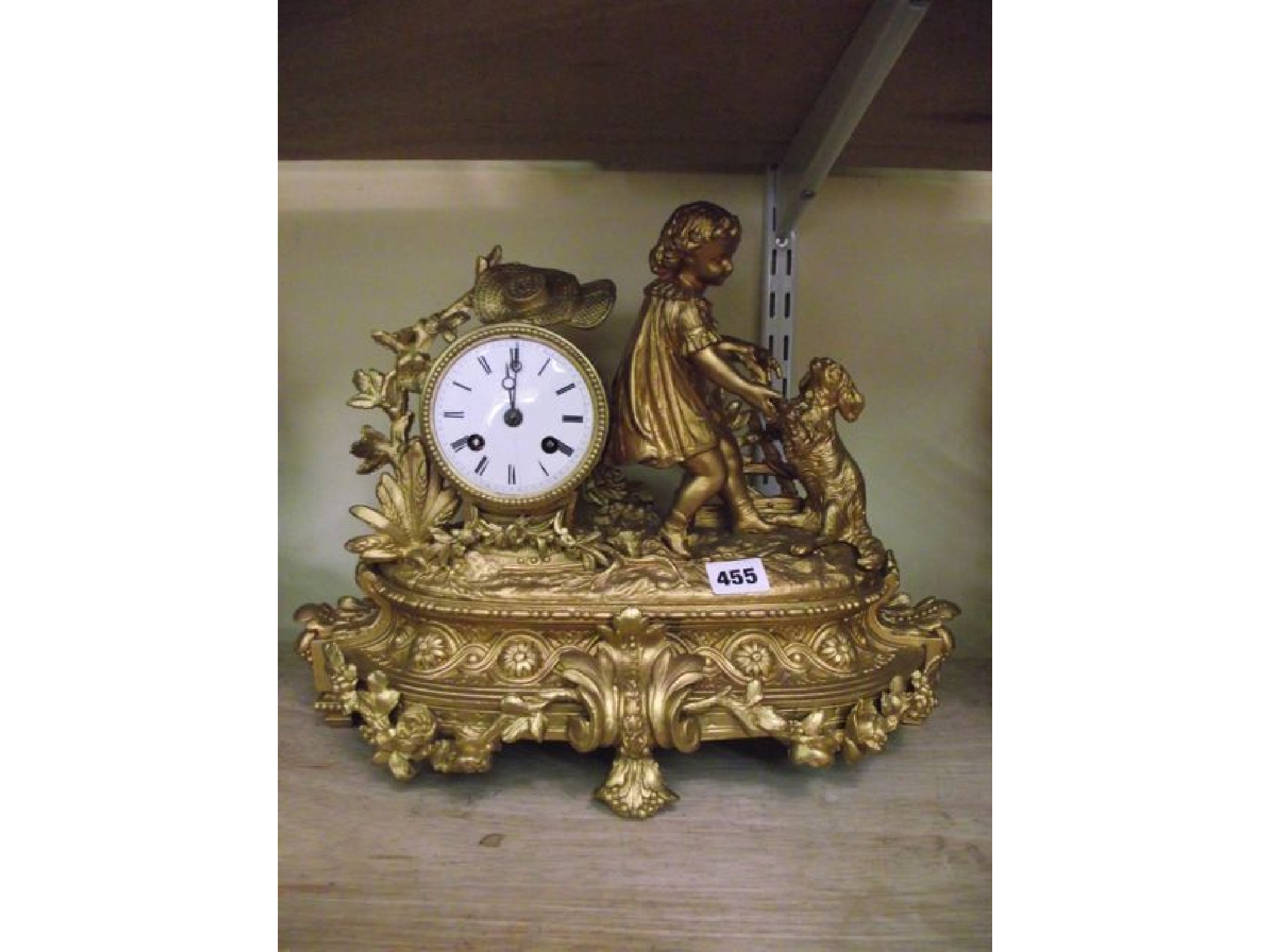 Appraisal: A th century gilded spelter mantel clock the -day striking